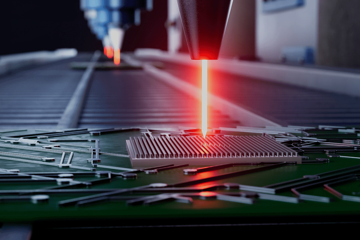 Laser cutting electronic components on circuit board.