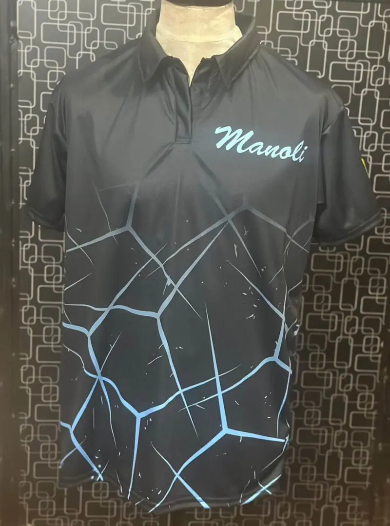 Black polo shirt with blue geometric pattern and 'Mansi' text.