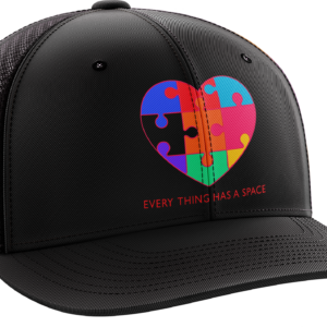 Black cap with colorful puzzle heart design.